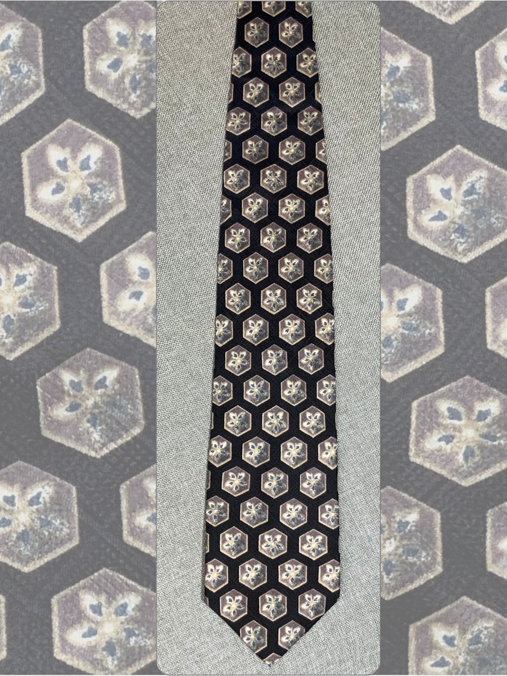 Geoffrey Beene silk tie, black ground with a repeating hexagon medallion pattern